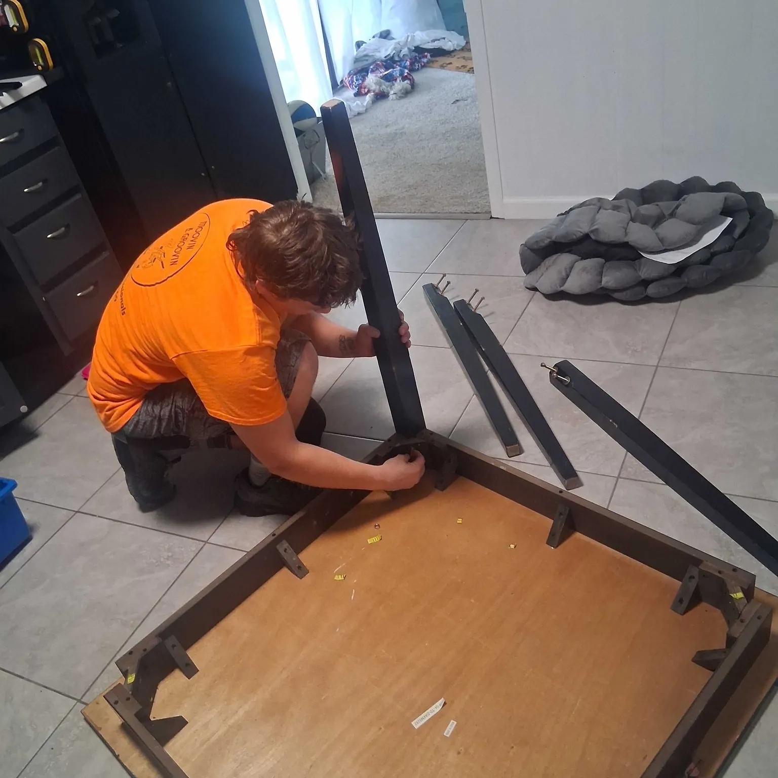 Employee assembling furniture