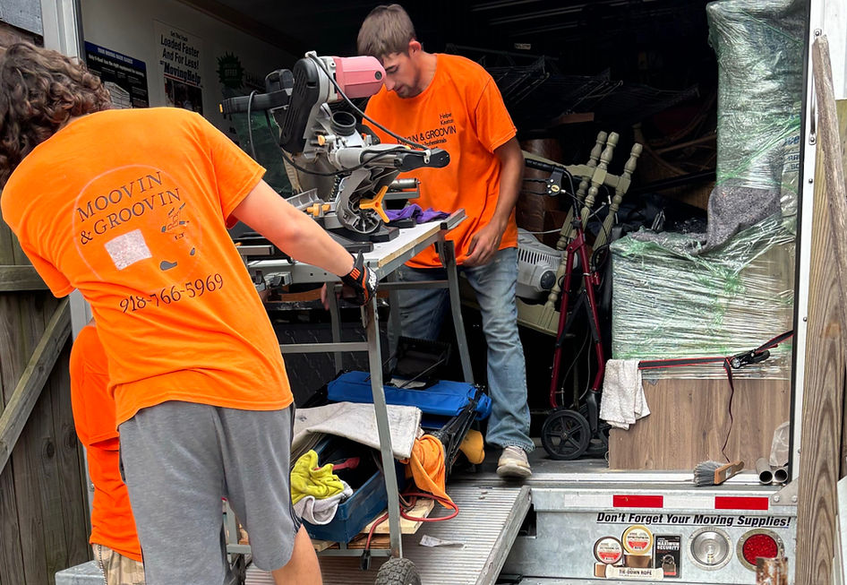 Moovin & Groovin team unloading moving truck