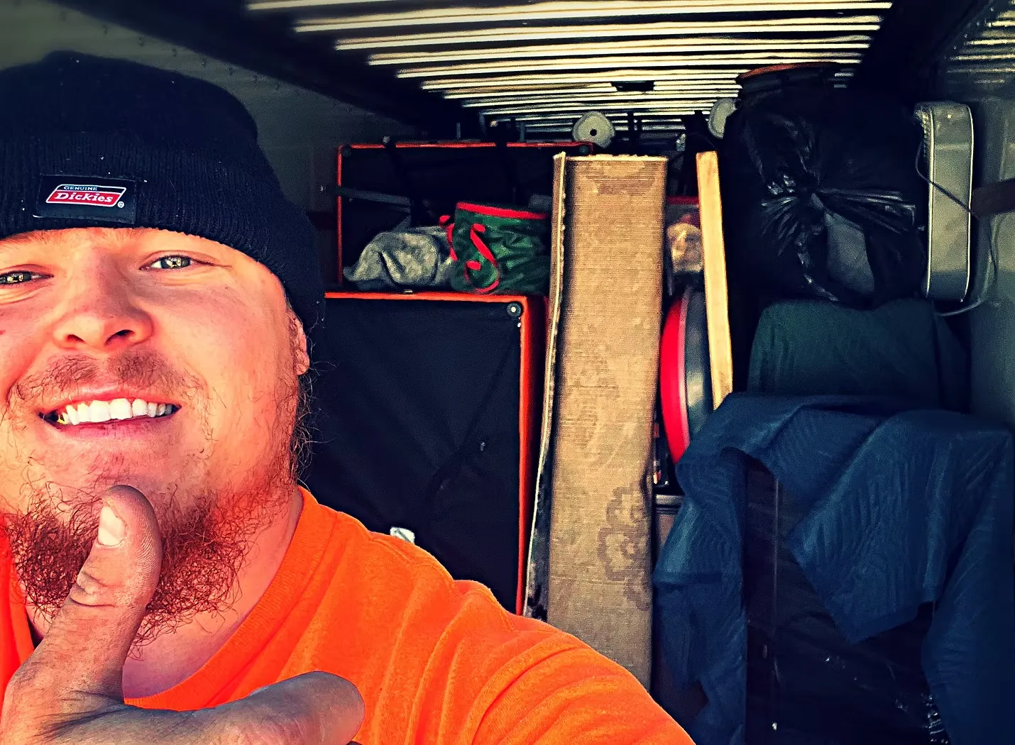 Moovin & Groovin team member with loaded truck