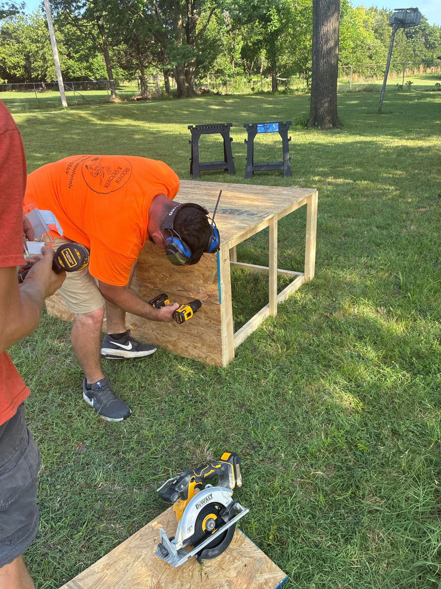 Moovin & Groovin mover assembling a custom wooden shipping crate for specialty items in Oklahoma City.